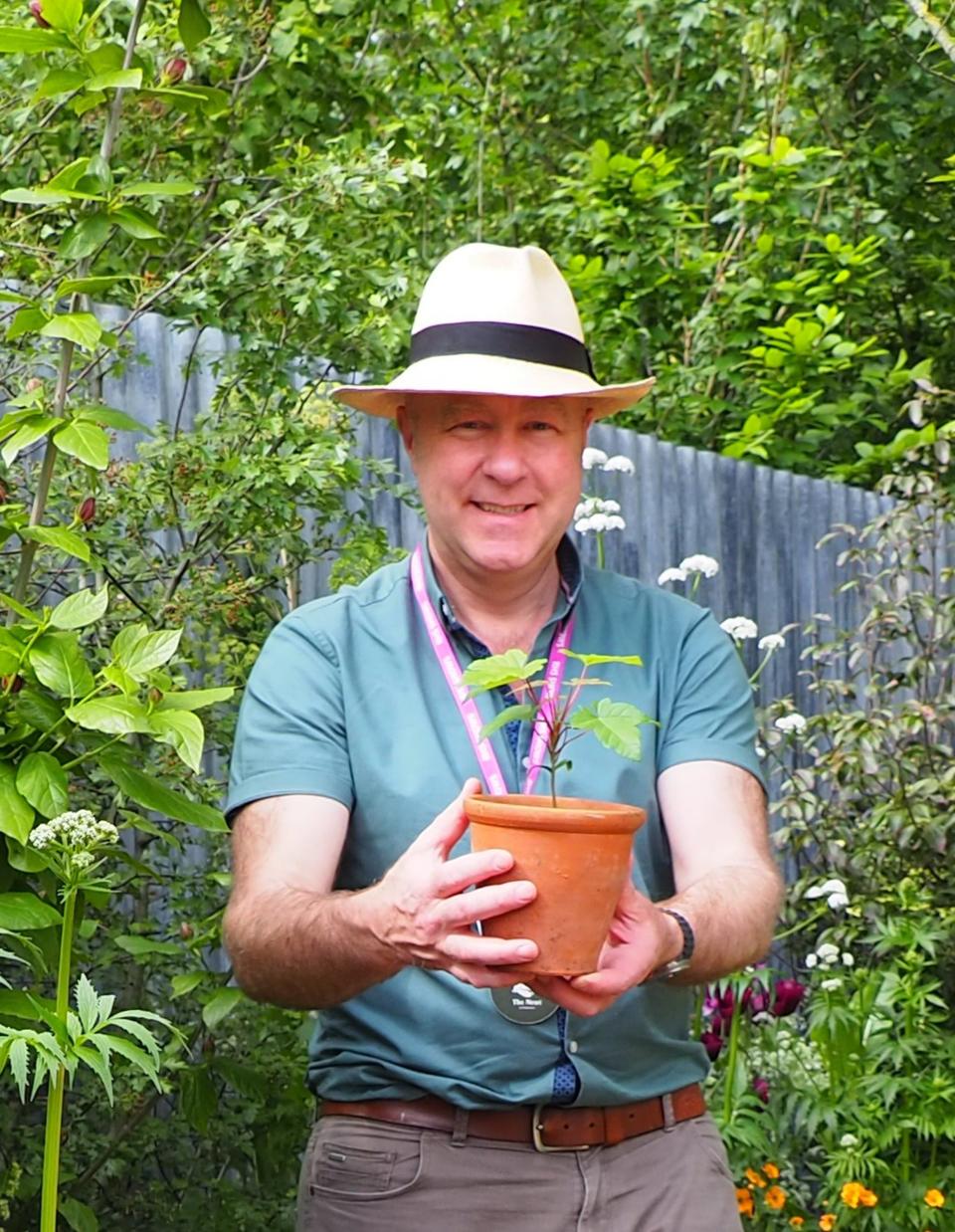 Director of Gardens and Parklands at the National Trust, Andy Jasper, with the first Sycamore Gap seedling at the Chelsea Flower Show last week (Ann-Marie Powell/PA Wire)
