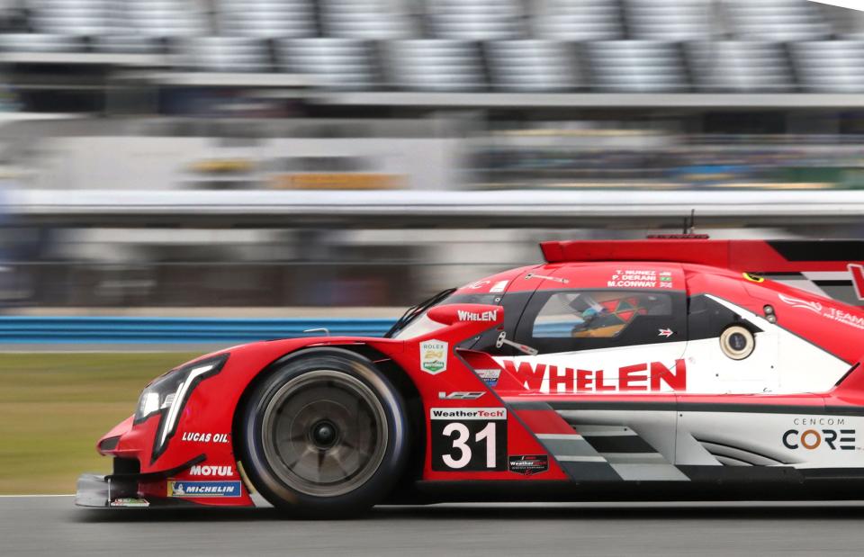 The No. 31 Cadillac DPi flies through the infield, Friday, Jan. 21, 2022, during Weather Tech Championship practice at Daytona International Speedway.