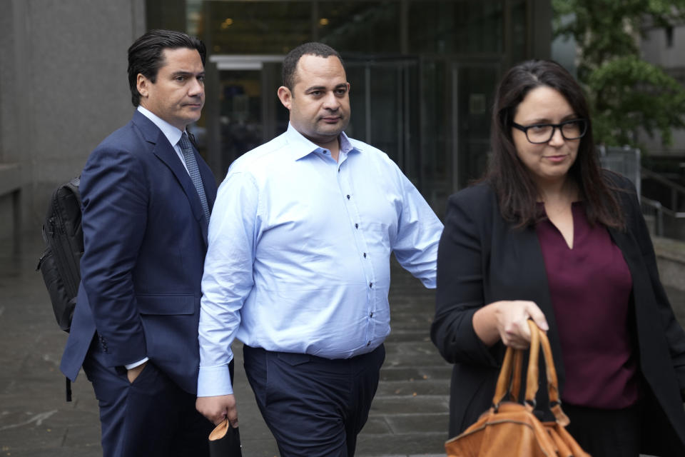 Wael Hana, center, leaves the federal courthouse in New York, Tuesday, Sept. 26, 2023. Hana is a co-defendant with Robert Menendez, the longtime chairman and top Democrat on the powerful Senate Foreign Relations Committee, who is accused of using his position to aid the authoritarian government of Egypt and to pressure federal prosecutors to drop a case against a friend, among other allegations of corruption. (AP Photo/Seth Wenig)