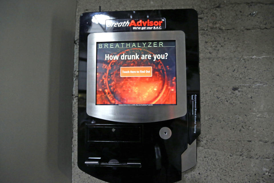 A Breathalyzer hangs on the wall near the front door of Zest Kitchen & Bar Friday, Feb. 14, 2014, in Salt Lake City. Breathalyzers and similar devices could pop up in more bars across Utah under a coming proposal from Draper Republican Rep. Greg Hughes. The measure is still incubating, but it aims to cut down on drunk driving in Utah. (AP Photo/Rick Bowmer)