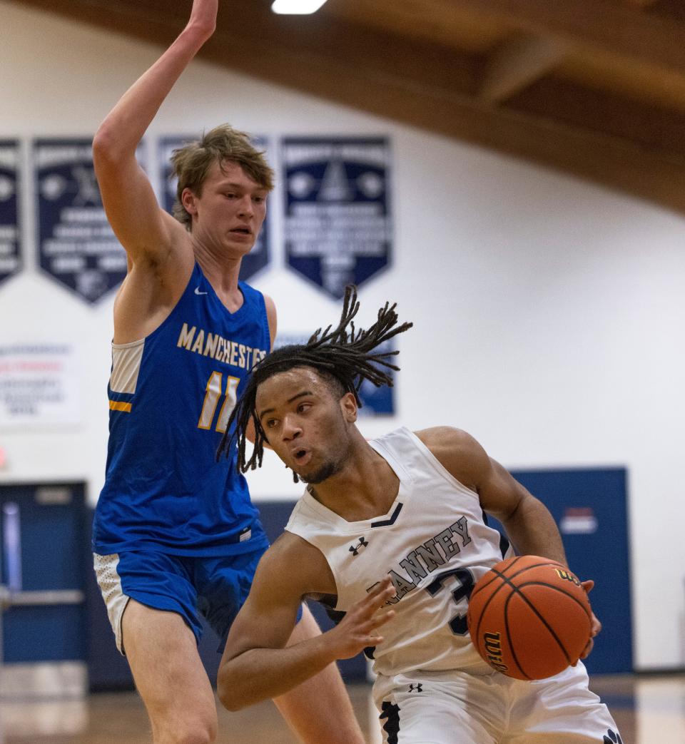 Ranney Isaac Hester drives in towards the basket against Manchester Evan Weiner. Ranney Boys Basketball defeats Manchester in Tinton Falls on January 26, 2022. 