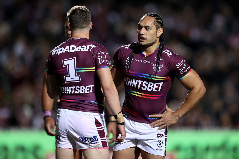 Seen here, Manly's Martin Taupau standing with Sea Eagles teammate Reuben Garrick during the round 20 loss against the Roosters.