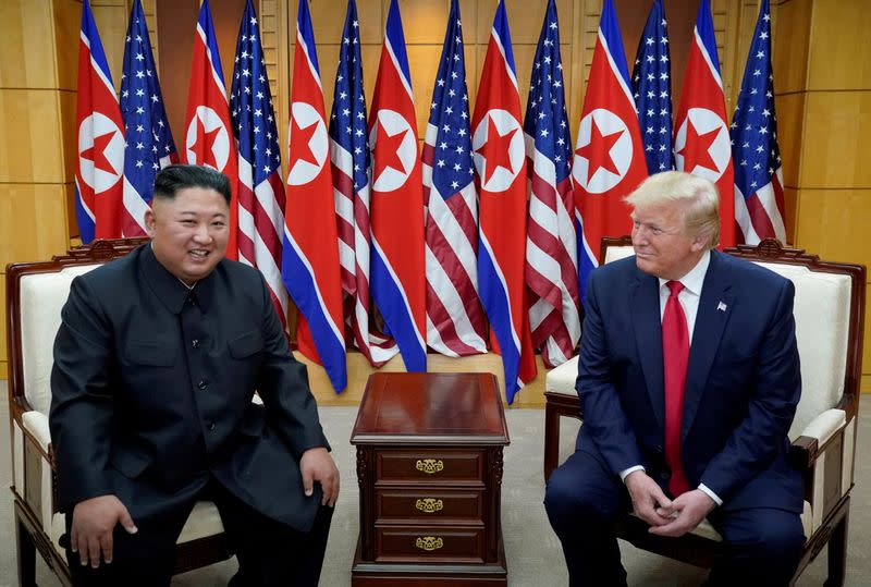 FILE PHOTO: Trump meets with North Korean leader Kim Jong Un at the DMZ on the border of North and South Korea