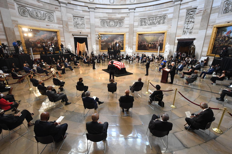 People attend a memorial service for the late Rep. John Lewis, D-Ga, as he lies in state at the Capitol in Washington, Monday, July 27, 2020. (Matt McClain/The Washington Post via AP, Pool)