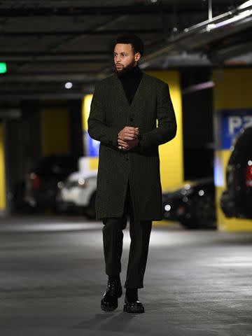 <p>Noah Graham/NBAE via Getty</p> Stephen Curry #30 of the Golden State Warriors arrives to the arena before the game against the Memphis Grizzlies on December 25, 2022 at Chase Center in San Francisco, California