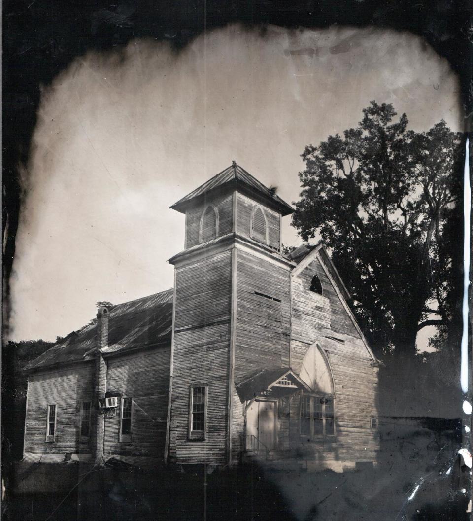 In this image made by Euphus Ruth Jr. of Greenville, Miss., is Estill Baptist Church in Estill, Miss. Once a thriving church, it's no longer in use and slowly deteriorating at the edge of cotton fields, according to Ruth Jr.. Wet plate collodion photography, invented in 1851, has experienced a resurge in recent years as photographers turn to this antiquated method for its moody, haunting images and complicated, hands-on process. (AP Photo/Euphus Ruth Jr.)