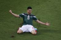 Mexico's Oribe Peralta celebrates after scoring a goal during their 2014 World Cup Group A match against Cameroon at Dunas arena in Natal June 13, 2014. REUTERS/Carlos Barria