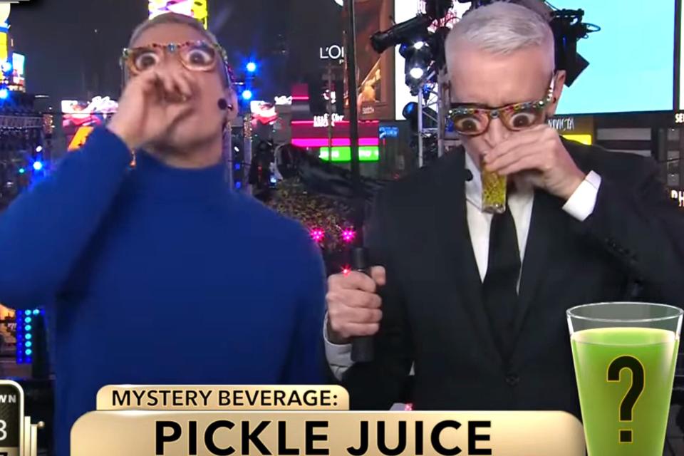 See Anderson Cooper and Andy Cohen take shots of mystery liquid