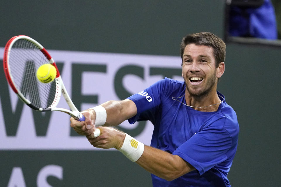 Cameron Norrie, of Britain, returns to Nikoloz Basilashvili, of Georgia, in the singles final at the BNP Paribas Open tennis tournament Sunday, Oct. 17, 2021, in Indian Wells, Calif. (AP Photo/Mark J. Terrill)