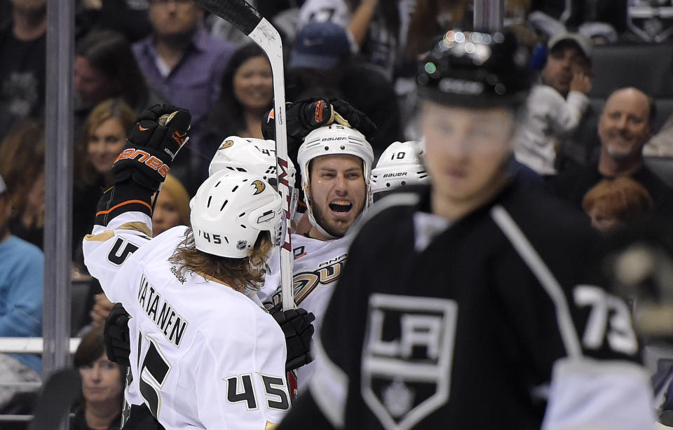 Anaheim Ducks center Ryan Getzlaf, third from left, celebrates his goal with teammates as Los Angeles Kings center Tyler Toffoli, right, looks on during the first period in Game 4 of an NHL hockey second-round Stanley Cup playoff series, Saturday, May 10, 2014, in Los Angeles. (AP Photo/Mark J. Terrill)