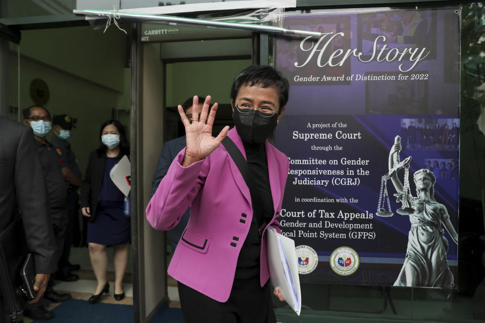 Filipino journalist Maria Ressa, one of the winners of the 2021 Nobel Peace Prize and Rappler CEO, gestures to the media after attending a court hearing on tax evasion cases against her at the Court of Tax Appeals in Quezon City, Philippines Wednesday, Jan. 18, 2023. The tax court on Wednesday cleared Ressa and her online news company of tax evasion charges she said were part of a slew of legal cases used by former President Rodrigo Duterte to muzzle critical reporting. (AP Photo/Basilio Sepe)