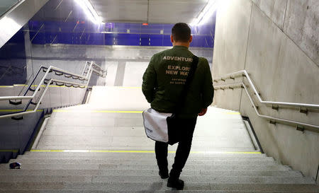 Basel, a 24 year-old migrant from Deraa in Syria, walks down a stairway in Vienna, Austria September 21, 2017. REUTERS/Leonhard Foeger