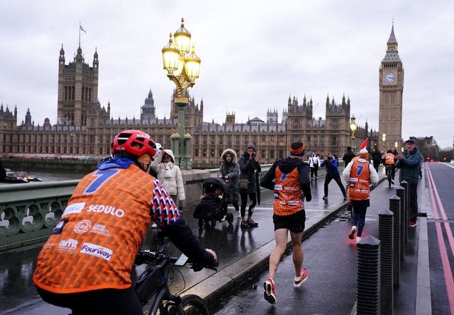 Kevin Sinfield passes over Westminster Bridge on day seven of the 7 in 7 in 7 Challenge in London