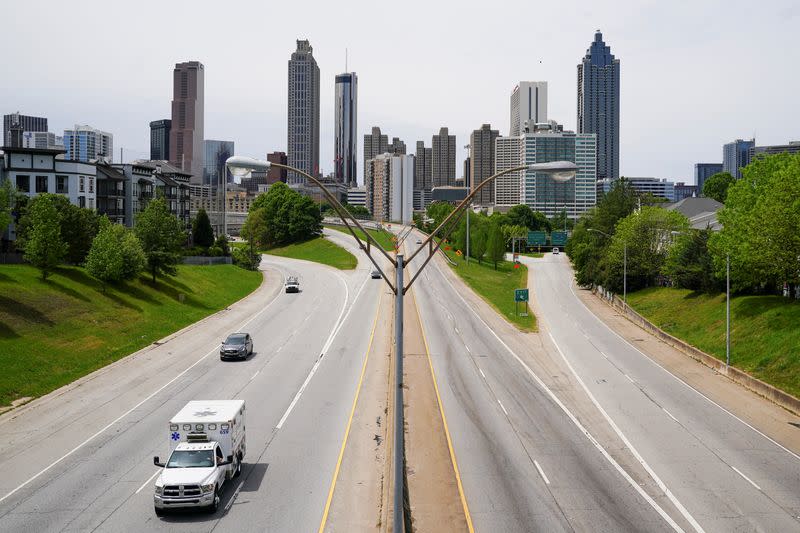 An ambulance is seen in the foreground of the Atlanta skyline days before the phased reopening of businesses from coronavirus disease rules in Atlanta