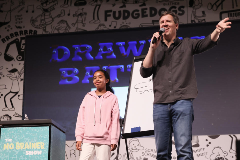 EL SEGUNDO, CALIFORNIA - OCTOBER 24: Bestselling author Jeff Kinney (R) launches 'Diary of a Wimpy Kid #18: No Brainer' with The No Brainer Show, an outrageously entertaining game show-style event, at El Segundo Performing Arts Center on October 24, 2023 in El Segundo, California as part of a 13-city book tour. (Photo by Rodin Eckenroth/Getty Images for Abrams Books)