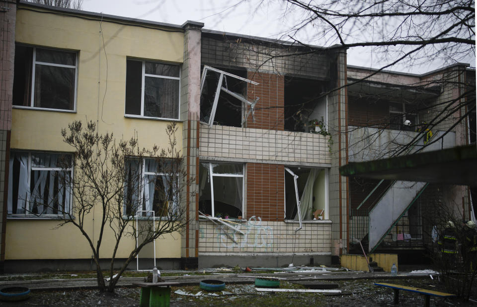 A view of the scene where a helicopter crashed on civil infrastructure in Brovary, on the outskirts of Kyiv, Ukraine, Wednesday, Jan. 18, 2023. The chief of Ukraine's National Police says a helicopter crash in a Kyiv suburb has killed 16 people, including Ukraine's interior minister and two children. He said nine of those killed were aboard the emergency services helicopter. (AP Photo/Daniel Cole)
