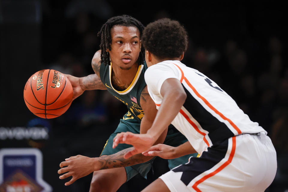 Baylor guard Dantwan Grimes is defended by Oregon State guard Josiah Lake II (2) during the second half of an NCAA college basketball game Wednesday, Nov. 22, 2023, in New York. (AP Photo/Eduardo Munoz Alvarez)