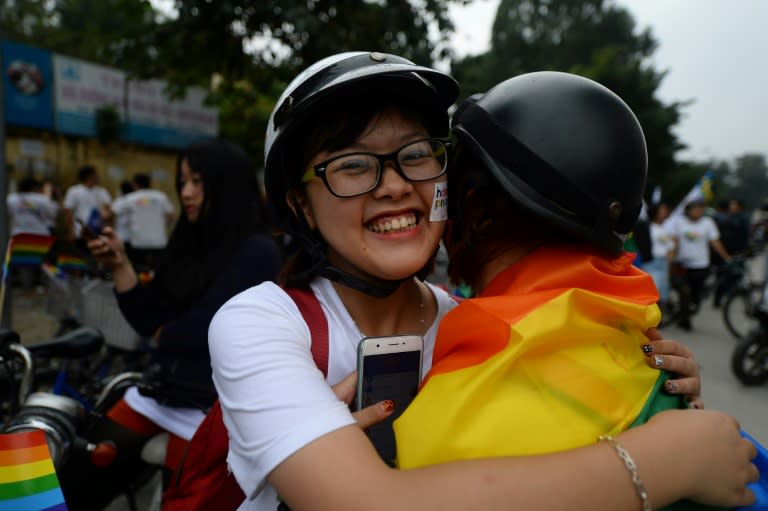 People in the parade Sunday were all smiles as they rode colourful bicycles and waved rainbow flags, marching down Hanoi's tree-lined streets