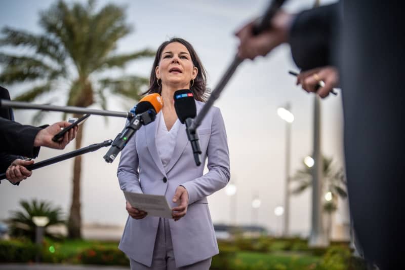 German Foreign Minister Annalena Baerbock gives a press statement upon her arrival at the airfield in Jeddah. Michael Kappeler/dpa