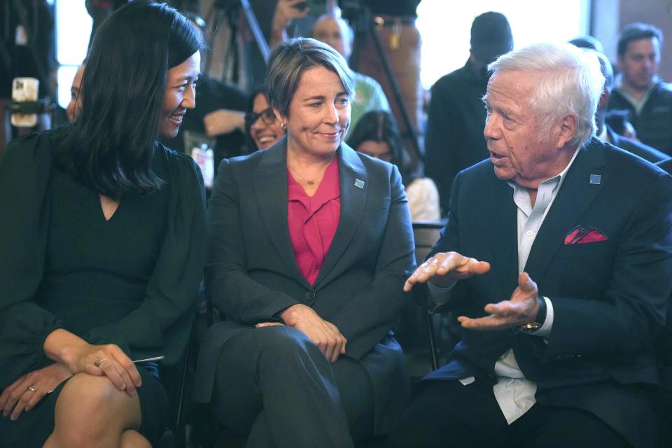 Boston Mayor Michelle Wu, left, Massachusetts Gov. Maura Healey, center, and New England Patriots owner Robert Kraft, right, speak before ceremonies held to unveil Boston Soccer 2026's local branding for the 2026 World Cup, Thursday, May 18, 2023, in Boston. Gillette Stadium in Foxborough, Mass., is one of 16 venues in the United States, Mexico and Canada tapped to host soccer matches for the international sporting event. (AP Photo/Steven Senne)