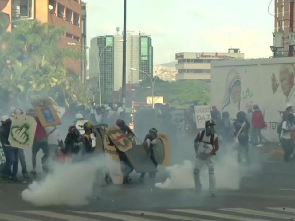 Venezuela protests: Hugo Chavez's childhood home set on fire as violence clashes continue