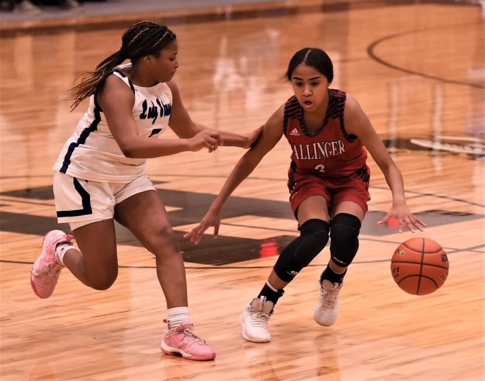 Ballinger's Matilda Galvan, right, brings the ball up court as Wichita Falls City View's Amani McKinney defends in the second half.