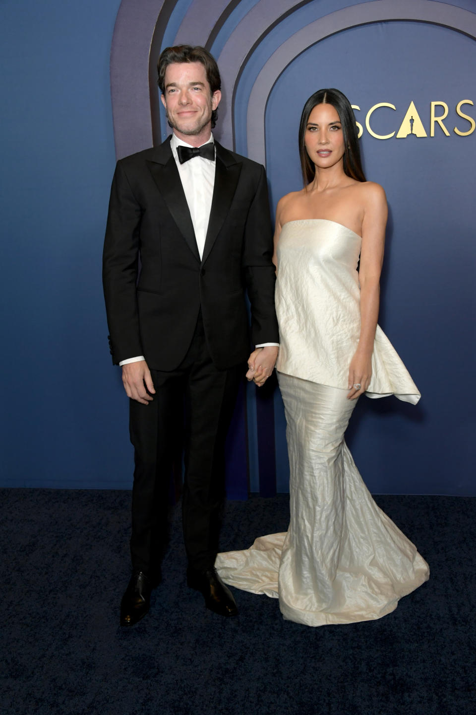 Olivia Munn wears strapless white, wrinkled, dress to the Governors Awards (Image via Getty Images)