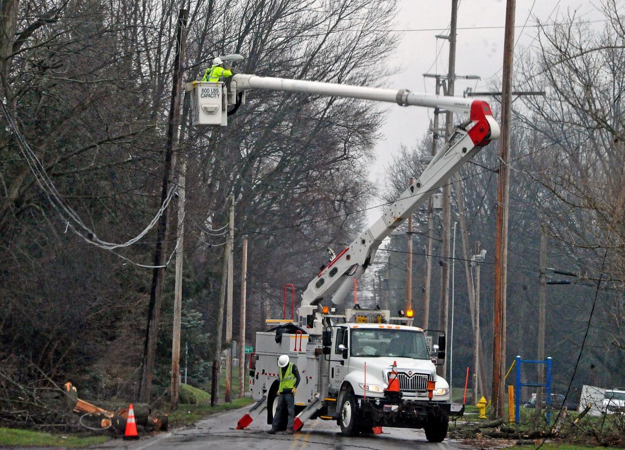 An AEP utility crew works to restore power to a line on Palmer Street in Wooster Monday. The company anticipated having the power back on for all Wooster area residents by 6 p.m. Tuesday.