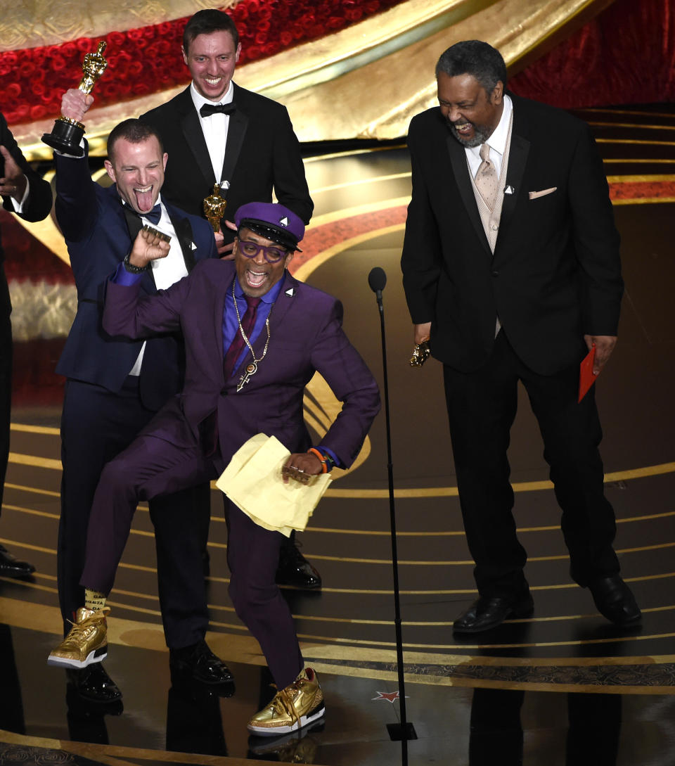 FILE - Spike Lee, foreground center, Charlie Wachtel, from left, David Rabinowitz and Kevin Willmott accept the award for best adapted screenplay for "BlacKkKlansman" at the Oscars in Los Angeles on Feb. 24, 2019. It was the first Oscar awarded to the veteran filmmaker. (Photo by Chris Pizzello/Invision/AP, File)