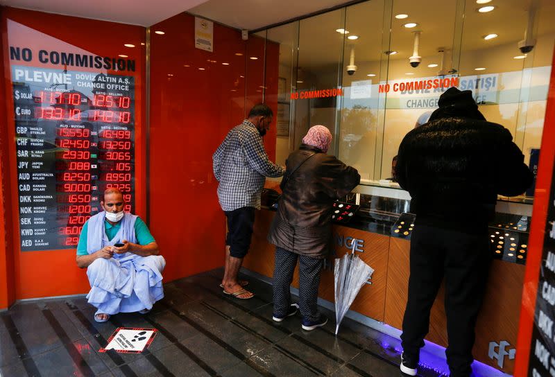 People change money at a currency exchange office in Istanbul