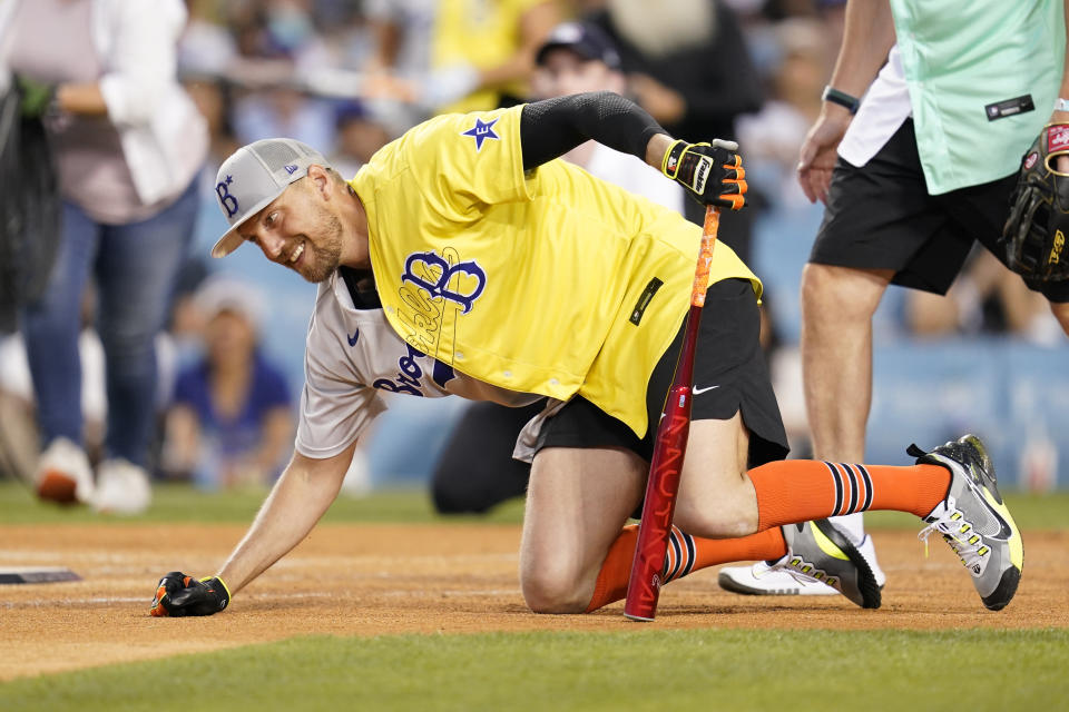 Former San Francisco Giants player Hunter Pence falls down while batting during the MLB All Star Celebrity Softball game, Saturday, July 16, 2022, in Los Angeles. (AP Photo/Abbie Parr)