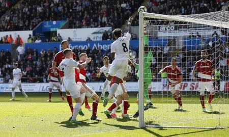 Britain Football Soccer - Swansea City v Middlesbrough - Premier League - Liberty Stadium - 2/4/17 Swansea City's Leroy Fer in action with Middlesbrough's Victor Valdes Action Images via Reuters / Andrew Boyers Livepic