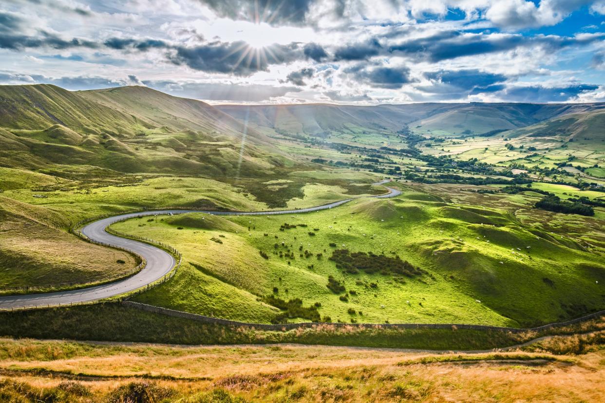 A sweeping road in the Peak District - All Rights Reserved