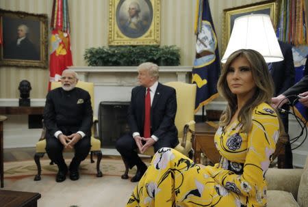 U.S. President Donald Trump (C) and first lady Melania Trump meet with Indian Prime Minister Narendra Modi in the Oval Office at the White House in Washington, U.S., June 26, 2017. REUTERS/Carlos Barria