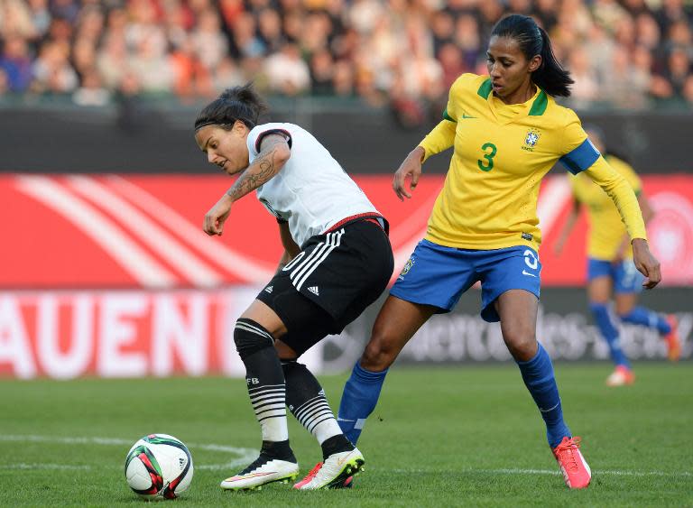 Germany'sDzsenifer Marozsan (L) and Brazil's Bruna Benites fight for the ball during their friendly match in Fuerth, southern Germany, on April 8, 2015