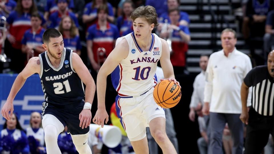 Kansas Jayhawks guard Johnny Furphy (10) dribbles against Samford Bulldogs guard Rylan Jones (21) during the first half of the first round of the 2024 NCAA Tournament at Vivint Smart Home Arena-Delta Center.