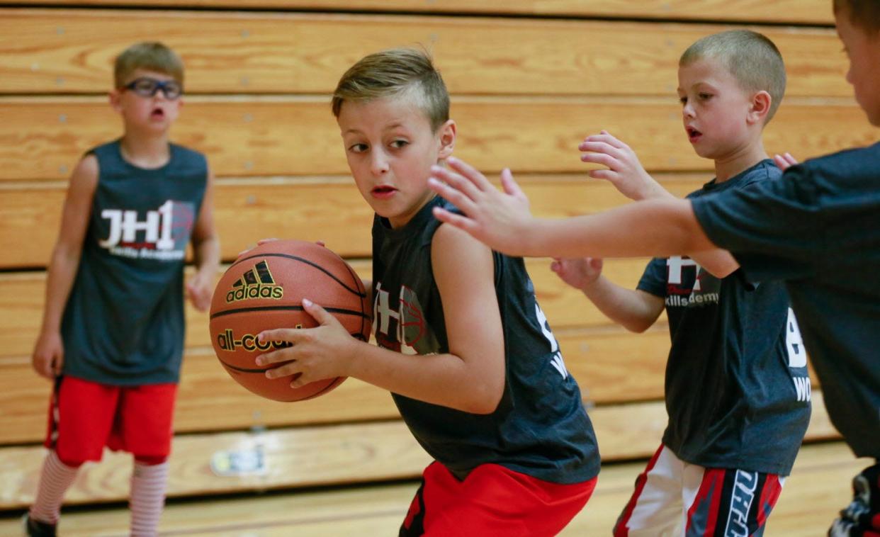 Braxton Bowman tries to move the ball to the basket during Jordan Hulls' basketball camp Friday in Bloomington. Jeremy Hogan | Herald-Times