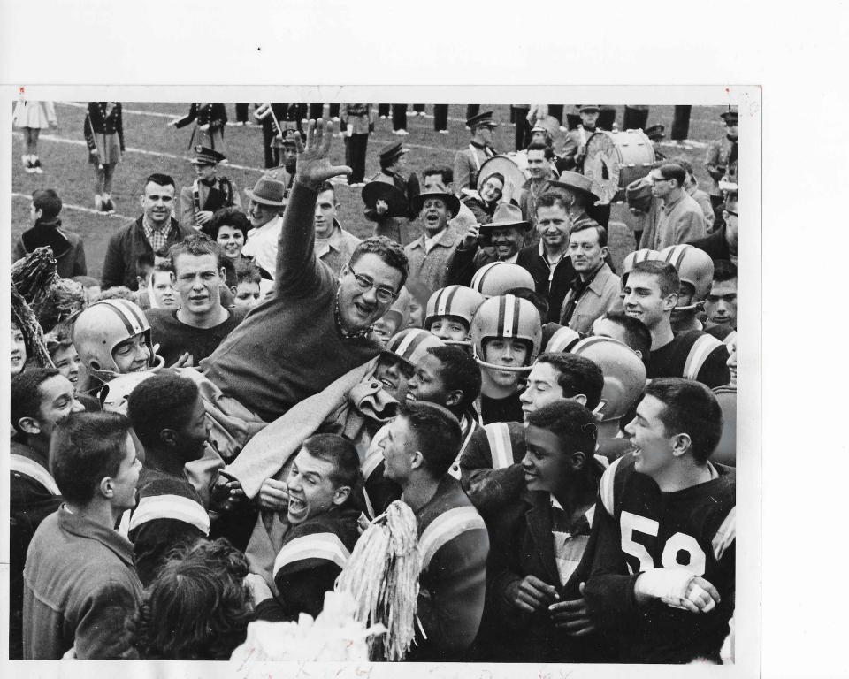 Garfield players hoist coach Daniel "Babe" Flossie on their shoulders after defeating Hower 8-0 for the Akron championship in 1957. Flossie won 12 city titles as a coach.