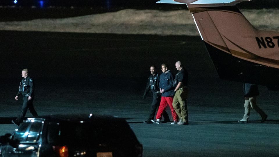 Bryan Kohberger is escorted by law enforcement after arriving at Pullman-Moscow Regional Airport on Thursday, Jan. 4, 2023, in Pullman, Wash. Kohberger was extradited from Pennsylvania earlier Thursday, for the alleged murder of four University of Idaho students on Nov. 13, 2022.  / Credit: Austin Johnson/AP