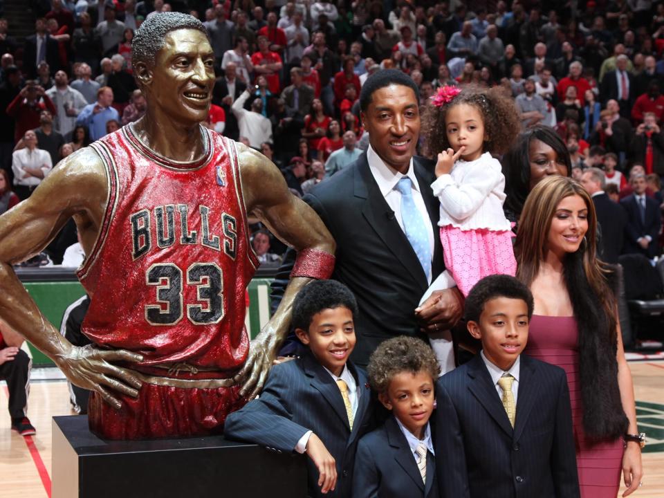 Scottie Pippen and his family view the unveiling of a bronze bust in his honor during a halftime ceremony of the game between the Chicago Bulls and the Boston Celtics on April 7, 2011 at the United Center in Chicago, Illinois