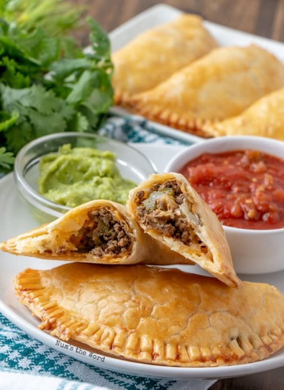 <p>Nums the Word</p><p>These Easy Beef Empanadas are delicious and use pre-made pie crust for their base.</p><p><strong>Get the recipe: </strong><a href="https://numstheword.com/easy-beef-empanadas/" rel="nofollow noopener" target="_blank" data-ylk="slk:Easy Beef Empanadas;elm:context_link;itc:0;sec:content-canvas" class="link rapid-noclick-resp"><strong>Easy Beef Empanadas</strong></a></p>