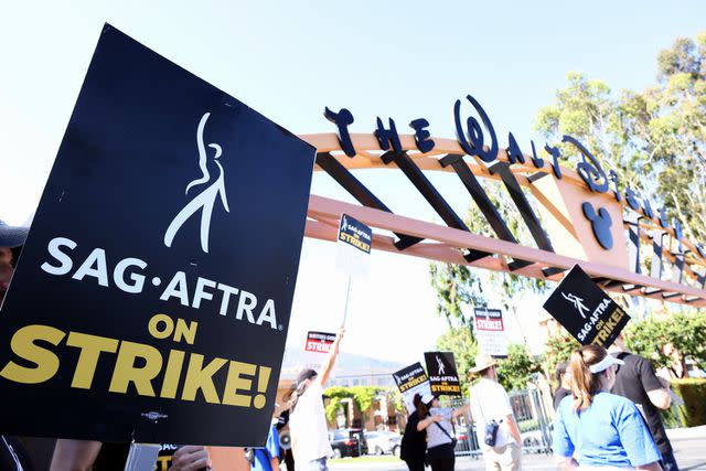 <p>Tommaso Boddi/Getty</p> Supporters of SAG-AFTRA and WGA on the picket line July 20, 2023, in Burbank, Calif.