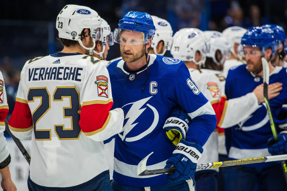 TAMPA, FL - MAY 26: Brayden Point #21 of the Tampa Bay Lightning shakes hands with the Florida Panthers after the series win in Game Six of the First Round of the 2021 Stanley Cup Playoffs at Amalie Arena on May 26, 2021 in Tampa, Florida. (Photo by Scott Audette/NHLI via Getty Images)