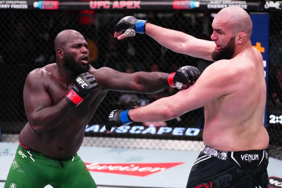 LAS VEGAS, NEVADA – MARCH 02: (L-R) Jairzinho Rozenstruik of Suriname punches Shamil Gaziev of Russia in a heavyweight bout during the UFC Fight Night event at UFC APEX on March 02, 2024 in Las Vegas, Nevada. (Photo by Jeff Bottari/Zuffa LLC via Getty Images)