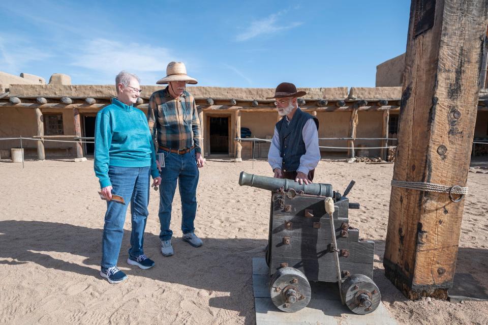 Linda Dietz, left, and Jim Dietz, center, are guided on a tour of Bent's Old Fort National Historic Site by park guide William Holcombe on Saturday, February 24, 2024.
