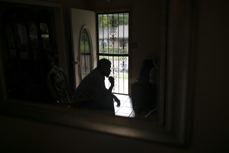 FILE - In this Sunday, June 9, 2019, file photo, La Jarvis Love is reflected in a mirror at his home in Senatobia, Miss. Paul A. West, a former Catholic brother, has been extradited from his home state of Wisconsin to Mississippi, where he faces sexual battery charges in a case involving two impoverished Black boys who say they were pressured as men into accepting paltry payouts to settle their abuse claims. The men making the allegations, La Jarvis Love and Joshua Love, both 37, are cousins who grew up together and encountered West in the 1990s, when he was a teacher and later the principal at the St. Francis of Assisi School in Greenwood, Miss. (AP Photo/Wong Maye-E, File)