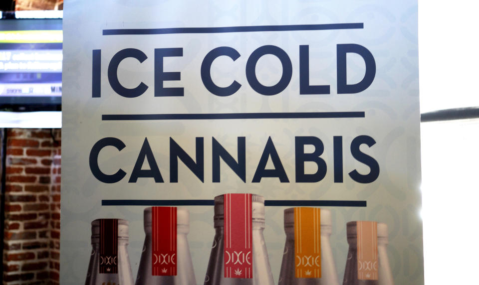 A banner hangs at the Dixie Elixirs and Edibles company booth at the CannaSearch cannabis industry job fair in downtown Denver September 16, 2014. (REUTERS/Rick Wilking) 