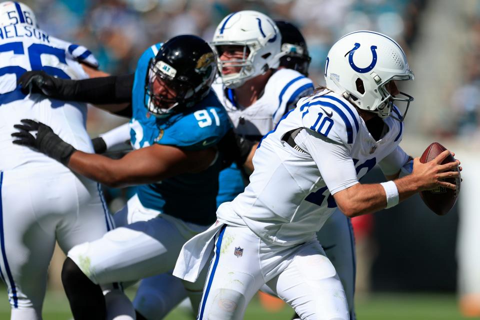 Indianapolis Colts quarterback Gardner Minshew (10) is flushed from the pocket during the third quarter Sunday against the Jacksonville Jaguars in Jacksonville, Fla.