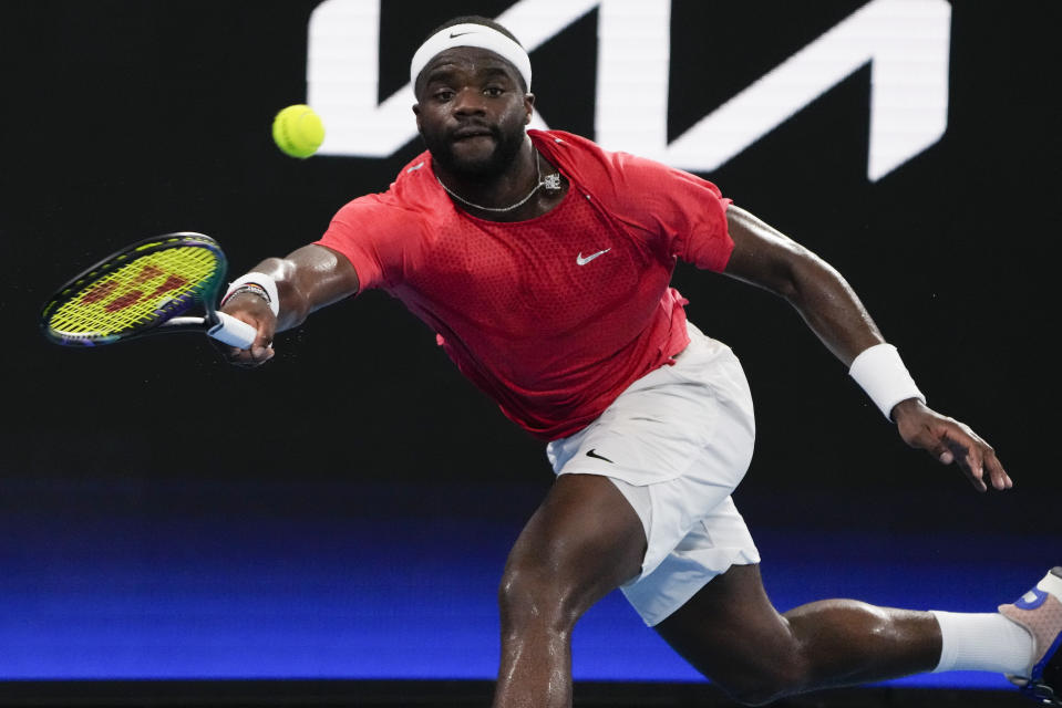 United States' Frances Tiafoe plays a forehand return to Poland's Kacper Zuk during their semifinal match at the United Cup tennis event in Sydney, Australia, Friday, Jan. 6, 2023. (AP Photo/Mark Baker)