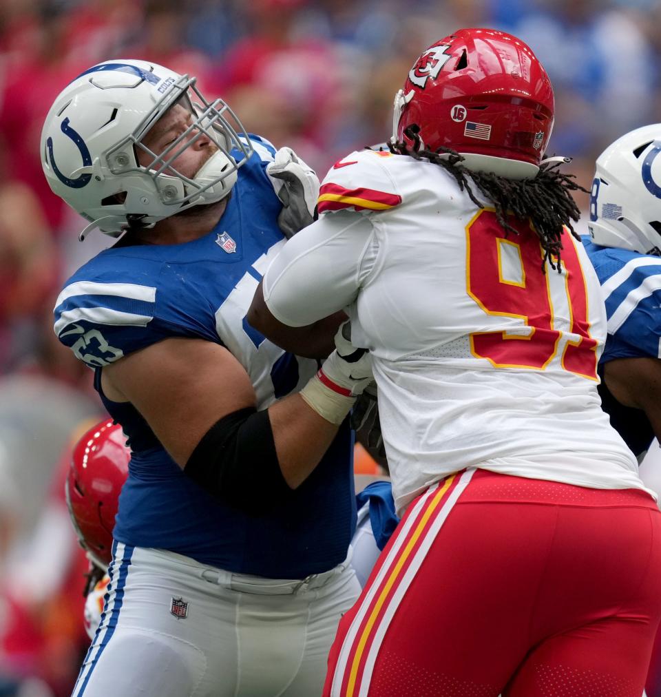 Indianapolis Colts guard Danny Pinter (63) fights off an advance by Kansas City Chiefs defensive tackle Derrick Nnadi (91) on Sunday, Sept. 25, 2022, during a game against the Kansas City Chiefs at Lucas Oil Stadium in Indianapolis.